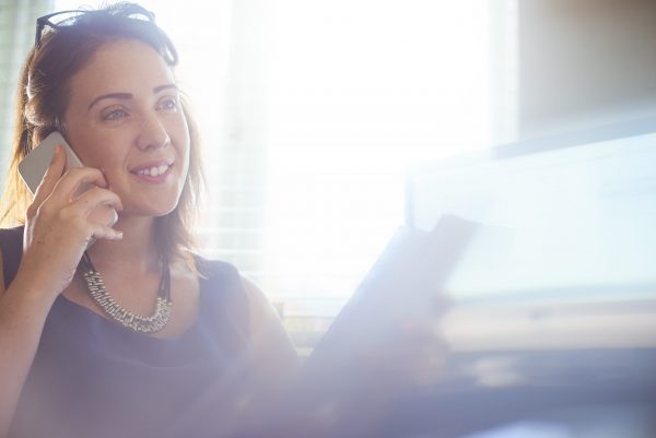 A businesswoman on the phone to one of her clients