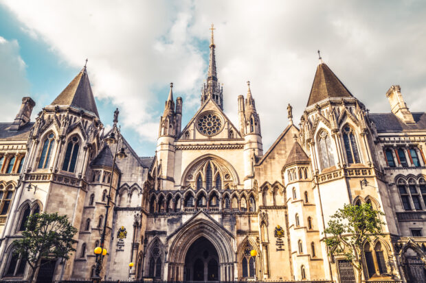 The exterior of the Royal Courts of Justice - a gothic revival style building.