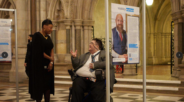 Photo of two people at the Justice Without Limits exhibition